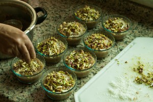 Adding nuts to Caraway Pudding (Karawya)
