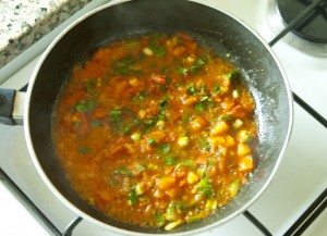 Shakshoukeh cooking onion with tomato