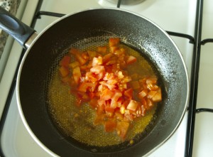 Shakshoukeh cooking tomato